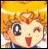 Pixelated cartoon character with orange hair, large dark eyes, and a red mouth against a yellow background.