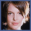 A pixelated image of a person with short brown hair wearing a dark blue dress, shown in three cropped views.