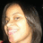 Pixelated close-up of a person with light skin tone, dark brown hair, and closed eyes against black background.