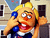 Pixelated cartoon character with blonde hair holding a blue object to their ear, standing in front of a building facade with windows and doors.