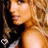 A pixelated image of a woman with long wavy blonde hair in a side profile pose, wearing a sleeveless top and showing shoulder and neck details.
