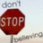 A red octagonal stop sign with white text reading 'STOP' is centered, with 'don't' in gray text above it against a light background.
