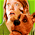 A pixelated contact sheet showing two frames of an animated icon featuring a cartoon character and dog with green text on the right side.