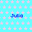Light blue background with repeating pink star pattern, six instances of the name "Julia" in dark blue pixelated text arranged in a