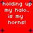 Red background with white pixelated text repeating 'holding up my halo.. is my horns!' and dark blue plus signs scattered throughout.