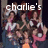 Group of people in a dark setting with text 'charlie's' above and 'angels' below, some holding pink objects.
