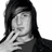 Pixelated grayscale portrait of a person with long dark hair, wearing a dark top, against a white background.