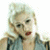 A 50x50 pixel animated contact sheet showing two frames of a buddy icon with a blonde woman on the left and green text "Original Icons .com" on the right against a dark background.