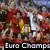 Pixelated group of figures in red and yellow attire with a large white '1' symbol, set against a blurred background with partial text reading "Euro Champa" at the bottom.