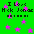 Green background with pink stars and repeated text "I Love Nick Jonas !!!!!!!!!" in black pixelated font.