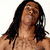 A pixelated image of a person with long dark hair and visible tattoos, alongside text elements reading "I AM" and "MRS. WAYNE" in bold block letters.