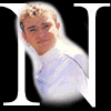 nine circular portrait cutouts arranged over large white letters on a black background, with one gray rectangle replacing the bottom-right corner