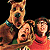 A 50x50 pixel animated contact sheet showing two frames of a Scooby-Doo themed buddy icon with characters and green text on dark background.