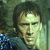 Pixelated close-up of a person with dark hair wearing a blue garment against a muted green background.