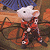 A pixelated contact sheet showing two frames of an animated icon featuring a cartoon mouse character in red clothing against a brown background, with green text reading "Original Icons .com" on the right side.