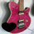 A red electric guitar with a brown neck appears in four , each featuring a different colored heart overlay