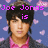 Pixelated image of a person with dark hair wearing a pink shirt and dark jacket against blue background with pink heart shapes, text overlays in purple pixel font.
