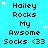 Pixelated text reads "Hailey Rocks My Awsome Socks <33" on a cyan background with scattered white stars, repeated in a pattern