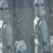 Static pixelated image with abstract blue-gray tones and scattered white highlights, appearing to be a low-resolution or heavily compressed visual artifact without discernible subjects or text.