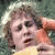 A pixelated image shows a person with curly hair holding a yellow object, next to text reading 'Have fixed carrot Go Me!' on a green background.