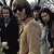 A contact sheet of two animated frames showing a group photo of four people with text "The Doors" on the right side.