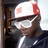 A person wearing a white and red cap, dark shirt, and light glasses appears in four showing head movement