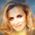 Pixelated portrait of a person with light brown hair and a yellow top against a blue sky background, static image with no visible text or symbols.