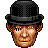 Pixelated headshot of a person wearing a black bowler hat with checkered pattern, brown hair with orange highlights, and glowing yellow cross-shaped eyes.