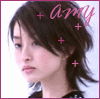 A 2x2 contact sheet of four animated frames showing a person with dark hair and pink text "amy" surrounded by plus signs, each frame displaying subtle facial expression changes.
