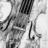 Black-and-white pixelated image of a figure with flowing hair and limbs, featuring red '<3' text in the bottom-right corner.