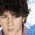 Six show a person with curly dark hair in various poses and expressions, including one with pink text reading "i love nick.j!"