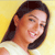 Static pixelated image of a person with long dark hair against a yellow background, wearing a light-colored top.