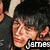 A pixelated image of a person with dark hair and light skin, wearing a black shirt, with the name 'James' displayed in white text on a black background.