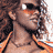 A woman in an orange bikini top with a visible navel, wearing sunglasses and curly hair, shown across three of animation