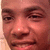 A person's face appears in four sections with varying expressions and background colors, showing subtle changes