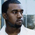Two side-by-side pixelated frames of a person with short dark hair wearing a white shirt against a light background on the left and a darker background on the right.