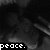 Black-and-white pixelated animation of a figure with text "peace." appearing in four positions across the frame.