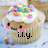 Pixelated cupcake icon with white frosting, colorful sprinkles, and a smiling face; black text 'i.l.y.' below.