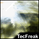 Pixelated image with blurred green and blue tones, a bright white area on the left, and black bar at bottom containing 'TecFreak' text.
