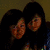 Two women with dark hair appear in a pixelated image, while two green plush characters and a black-and-white equal sign symbol are visible.
