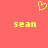 Yellow pixelated heart symbol above two instances of the name 'sean' in yellow text on a solid coral background.