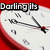 A clock face with red border and black hands, displaying 'Darling its time' text above it.