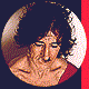 Four circular pixelated images of a person with dark curly hair in red and white clothing against dark background