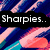 Pixelated image with four black text boxes on a colorful striped background, displaying partial phrases and punctuation.