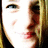 Pixelated close-up of a person's face showing eyes, nose, and lips with red lipstick against a light background.