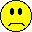 Three yellow pixelated smiley faces with black outlines on gray background; two have straight mouths, one has red tongue sticking out.