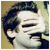 A pixelated image of a person with dark hair and light skin, alongside green text on black background reading "Soda Pop" above "and Chalk."