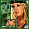 A pixelated image of a woman with blonde hair wearing a black bandana and dark clothing, with a green heart-shaped background and a smaller inset image of her face.