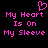 Pixelated pink text on black background reads "My Heart Is On My Sleeve" with a heart symbol above the first line.