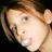 A pixelated image of a person with brown hair blowing a pink bubblegum bubble, set against a bright pink background with yellow text.